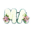 A beautifully composed sympathy tribute spells out MA in large, capital letters, resting against a simple white background that directs all attention to the details of the flowers. Each letter is completely carpeted in tight clusters of white chrysanthemums, their rounded, delicate petals forming a soft, cushion-like surface, reminiscent of freshly fallen snow. The blooms are positioned so closely together that they appear almost seamless, conveying a feeling of gentleness and quiet strength. Along the outer edges of the M and the A runs a neatly pleated band of rich green ribbon, adding a clean outline that enhances the shape of the letters and introduces a deep, natural contrast. At the base of the left leg of the M and the right leg of the A, two symmetrical floral groupings bring in subtle colour. These clusters feature soft pink roses and lilac-toned roses, some fully open and others just beginning to unfurl, nestled among smaller pink spray roses. Light, feathery fern fronds extend from the base of each cluster, their fresh green tones echoing the ribbon and softening the transition between letters and accents. The design feels calm, thoughtful and deeply personal, the sort of tribute often chosen in Friern Barnet to say farewell to a beloved mum or Mama at a church or crematorium nearby. Although the image is still, you can almost sense the hushed atmosphere of a service, with the subtle fragrance of roses and chrysanthemums offering comfort. This MA arrangement stands as a clear, floral expression of love, remembrance, and gratitude.