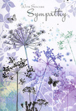 Inside this sympathy card, a soft, dreamlike meadow appears, as if inspired by the gentle greenery tucked between homes in Friern Barnet. Fine, elongated stems carry delicate umbel-shaped blossoms that fan out like tiny, lacy fireworks, their petals painted in hushed shades of lavender, indigo, and cool blue. The colouring is subtle and fluid, with each bloom partly transparent, allowing underlying washes of silvery green and muted purple to show through, much like layers of mist along the edges of Friary Park at dawn. The stems reach upwards with a sense of quiet purpose, creating a feeling of lift rather than weight. In the softly blurred background, pale violet and blue-grey tones blend seamlessly, forming a calm, atmospheric haze that suggests depth without clutter. Scattered among the flowers, a few butterflies hover in suspended motion, their wings only lightly outlined and tinted with gentle lavender and blue, as though they could dissolve into the air at any second. They add a whisper of transformation and continuing presence, a delicate nod to the loved one being remembered. The entire design feels cool yet comforting, a visual equivalent of a calm, reassuring voice. There is no bold contrast, only gradual transitions that allow the heart to settle. As a florist accustomed to helping local families express condolences, I recognise how this card's artwork mirrors the tender intention behind a thoughtfully chosen funeral arrangement: understated, respectful, and quietly filled with care, ready to carry sympathy from Friern Barnet to someone in need of solace.